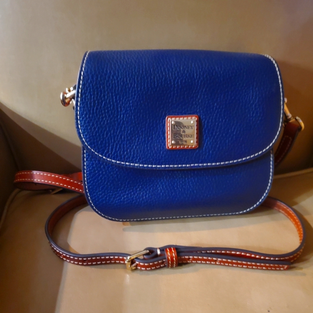 A pristine Doobey Bourke Navy leather mini cross body bag.
